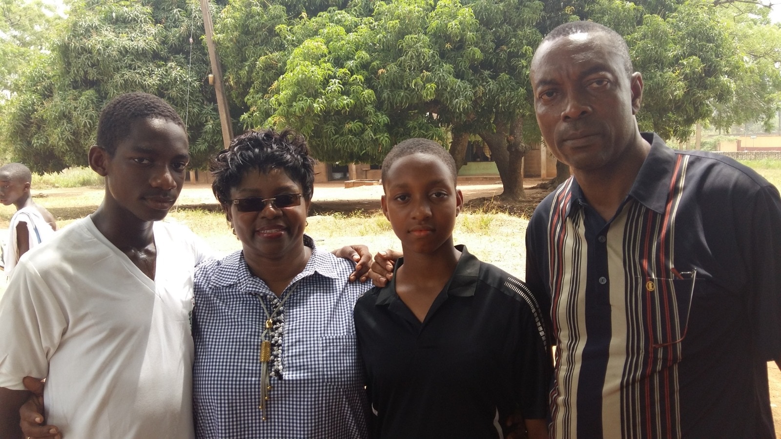 Dr. Oby Nwokedi outdoors with her husband and two of the children
