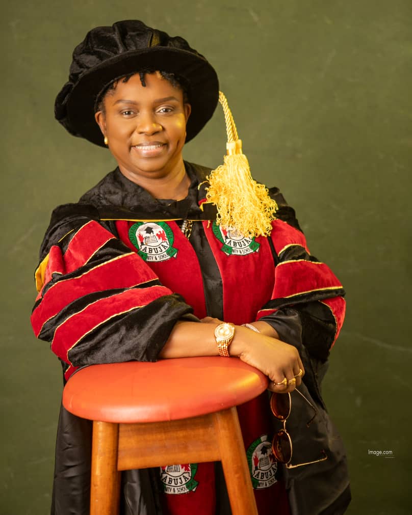 Dr. Oby Nwokedi in full doctoral regalia