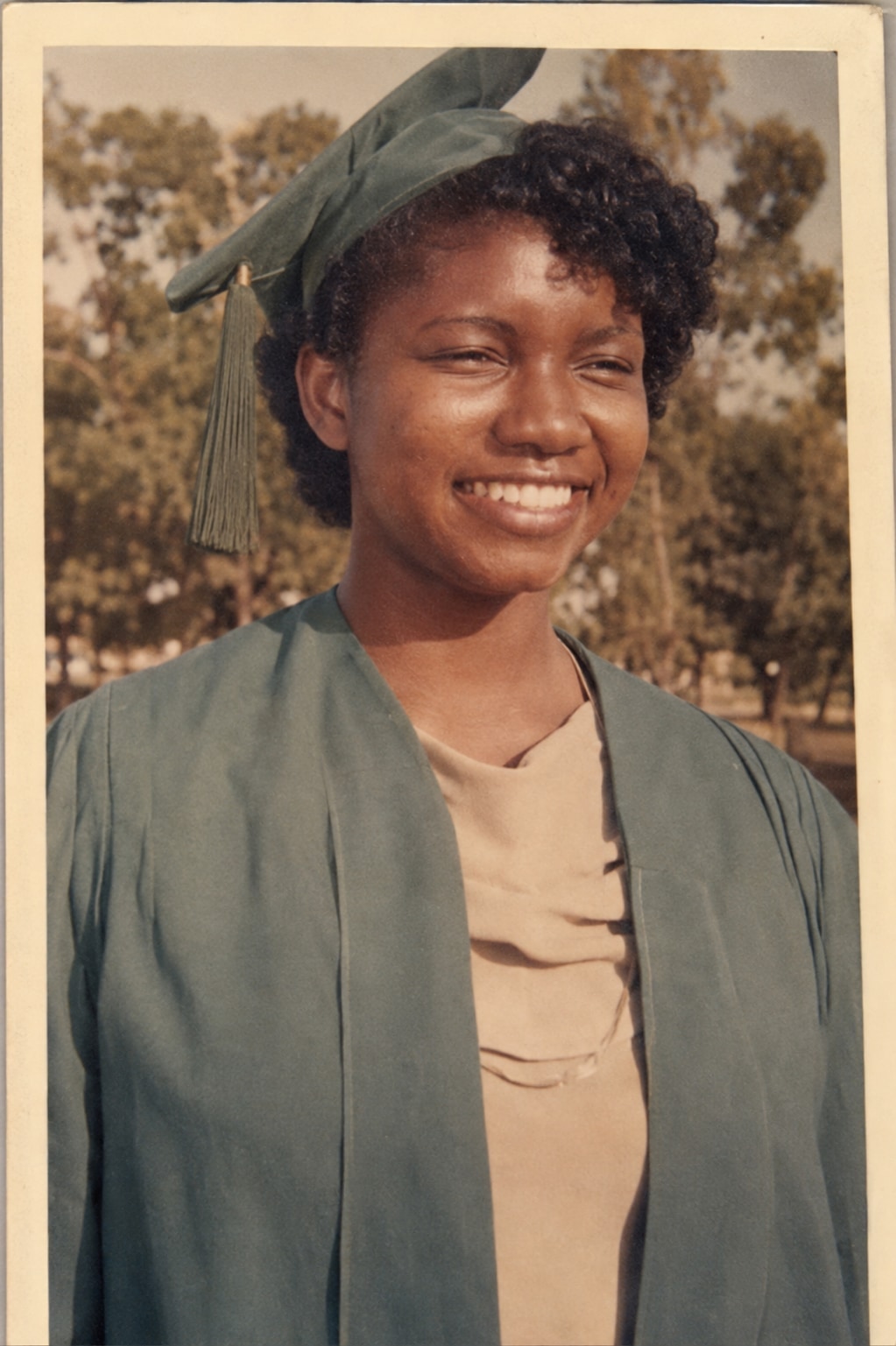 Oby Attoh as a young woman in a green cap and gown at her matriculation, University of Jos